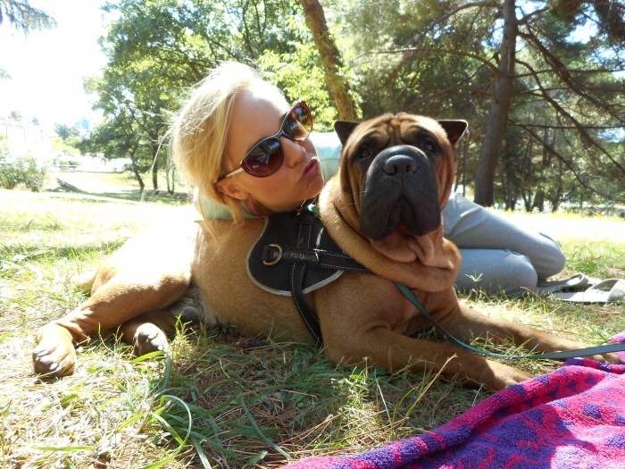Photo of Maja Monrue, author of Awakening Her, with her dog.